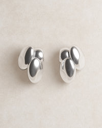 barcelona studs, blob studs, S925, sterling silver, rhodium plated, jewellery, minimal jewellery, sculptural jewellery, model, close up, front view, egg shaped, dented