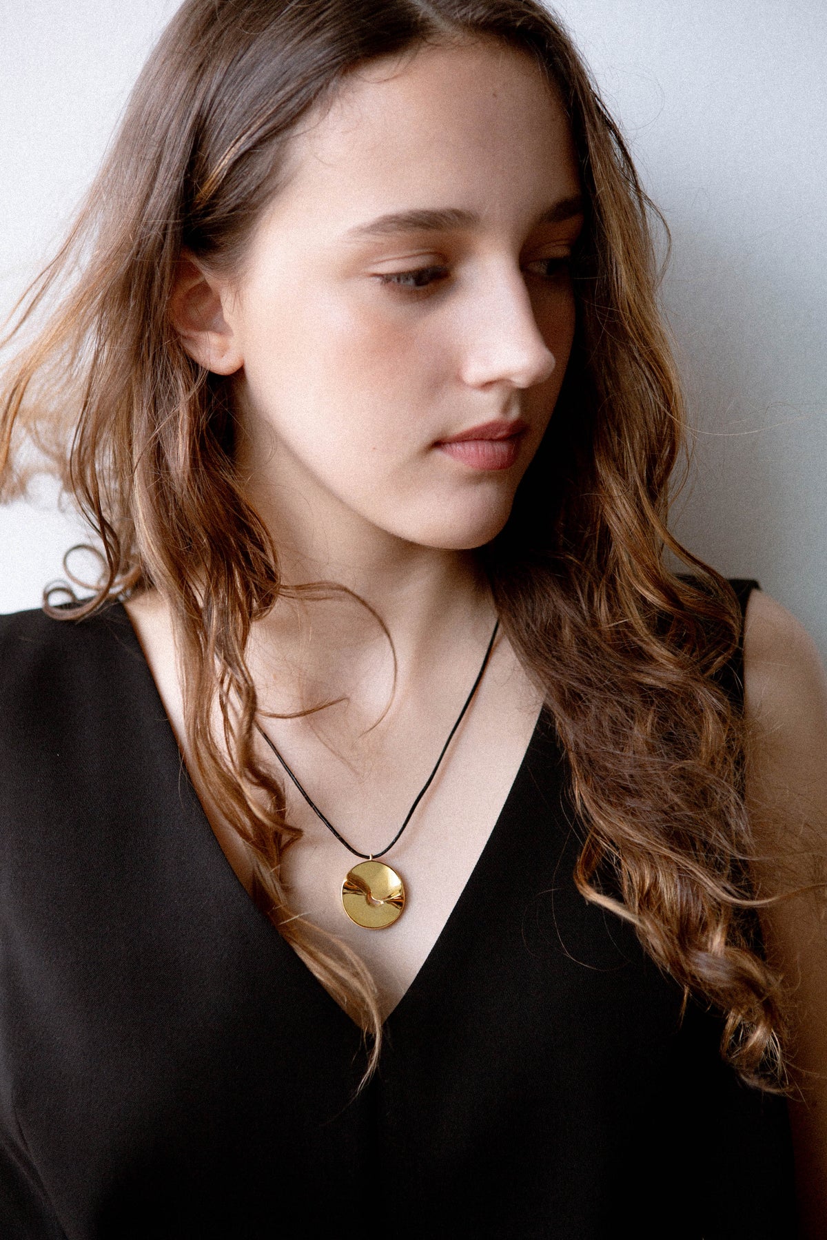model, campaign, valley of the moon necklace, jewellery, statement necklace, sculptural jewellery, minimal jewellery, gold vermeil, 18k gold vermeil, adjustable cord, front view