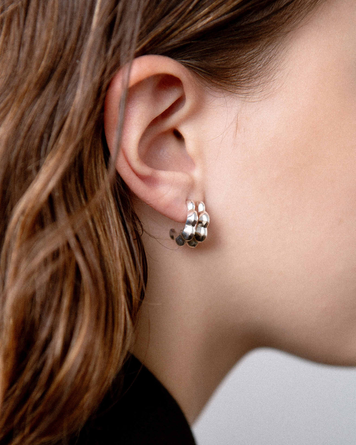 double petal studs, side view, model, jewellery, close up, sterling silver, S925, sculptural jewellery