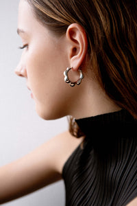 petal hoops, geometry, geometric, flower, petals, S925, sterling silver, rhodium plated, jewellery, minimal jewellery, sculptural jewellery, model, shot, close up, front view, issey miyake