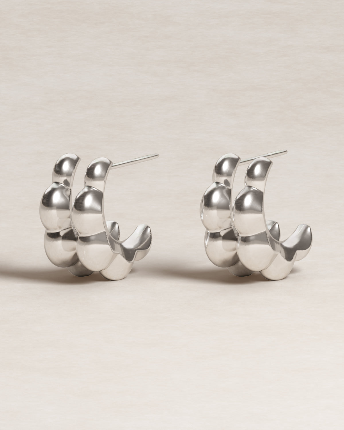 double petal studs, frontal view, model, jewellery, product shot, sterling silver, S925, sculptural jewellery