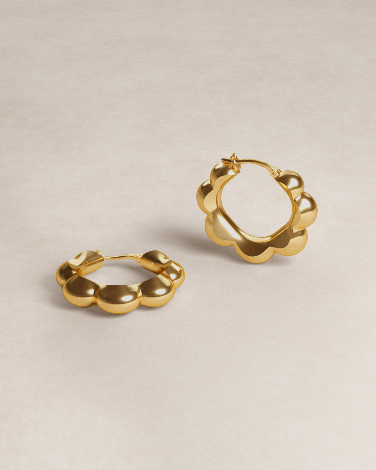 petal hoops, geometry, geometric, flower, petals, gold vermeil, 18k gold vermeil, jewellery, minimal jewellery, sculptural jewellery, product shot, close up, front view