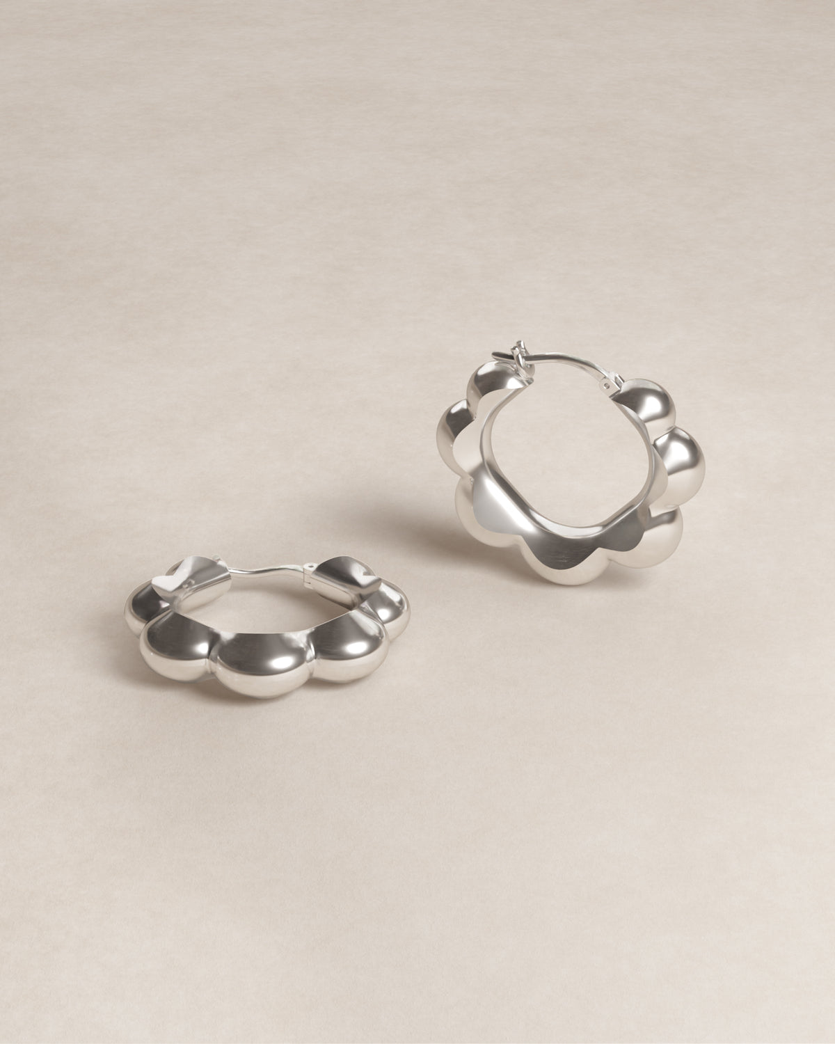 petal hoops, geometry, geometric, flower, petals, S925, sterling silver, rhodium plated, jewellery, minimal jewellery, sculptural jewellery, product shot, close up, front view