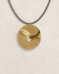close up, product shot, valley of the moon necklace, jewellery, statement necklace, sculptural jewellery, minimal jewellery, gold vermeil, 18k gold vermeil, adjustable cord, front view